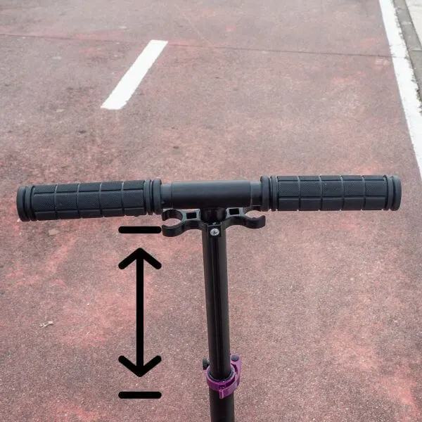 Handlebars of a scooter showing height can be adjusted