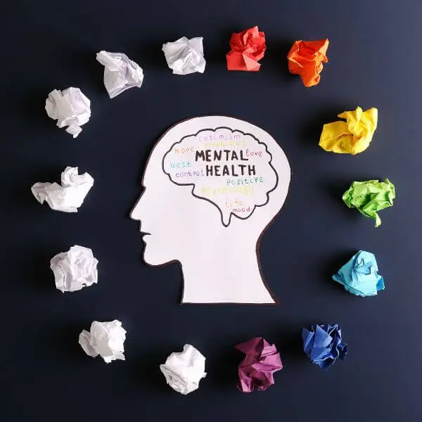 a picture of brain with mental health written inside and white papers on left side and colored papers on right side, kick scooter exercise benefits help in mental health